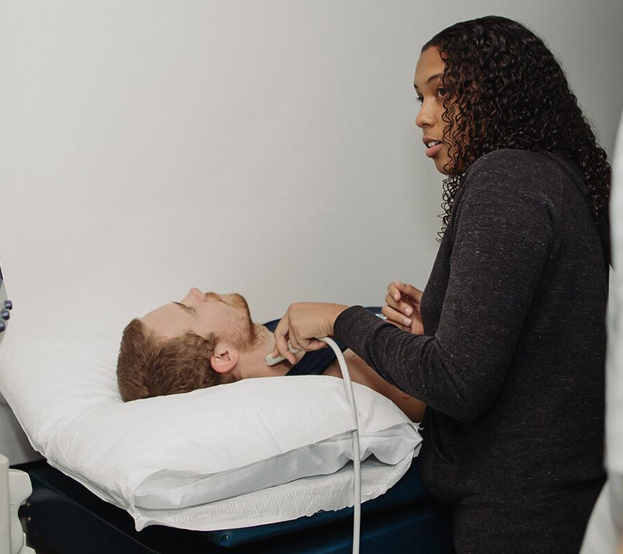 a health student performing a test on a patient